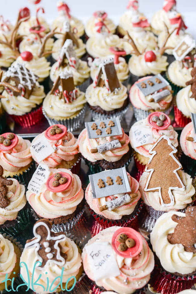 Collection of Christmas cupcakes on a baking sheet.