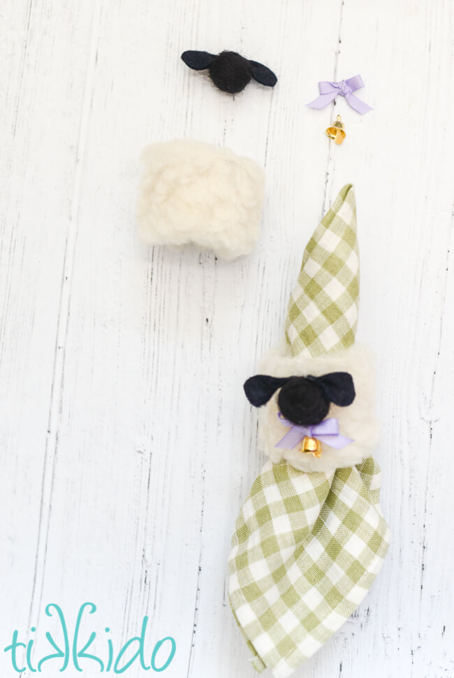 Assembling Easter napkin rings that look like fluffy sheep.