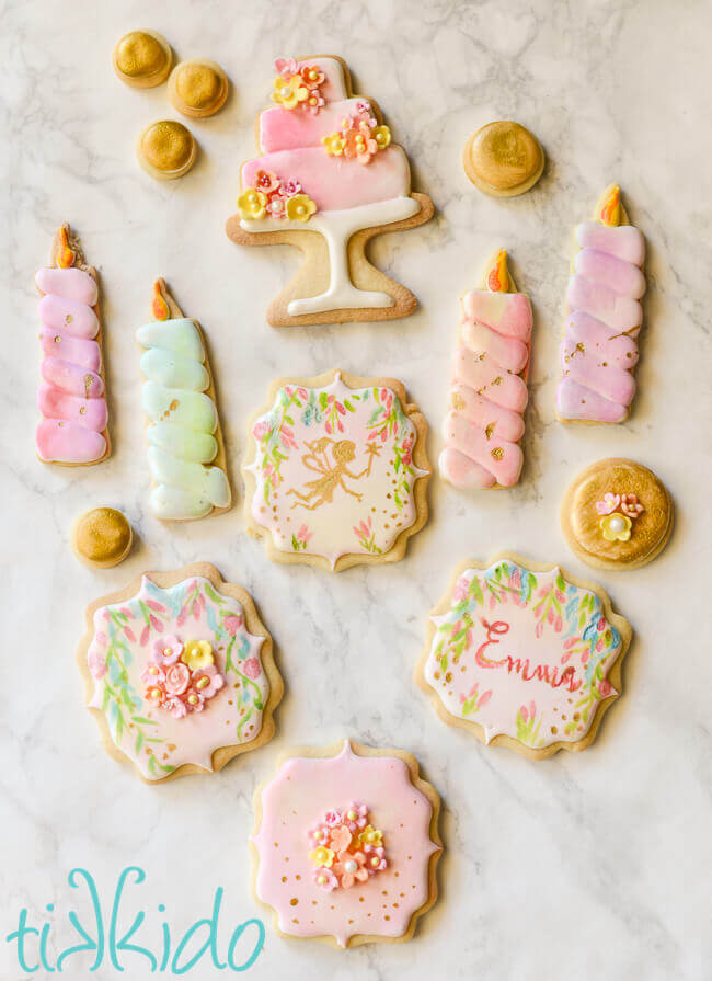 Watercolor fairy sugar cookies painted in pastel colors for a fairy birthday party.