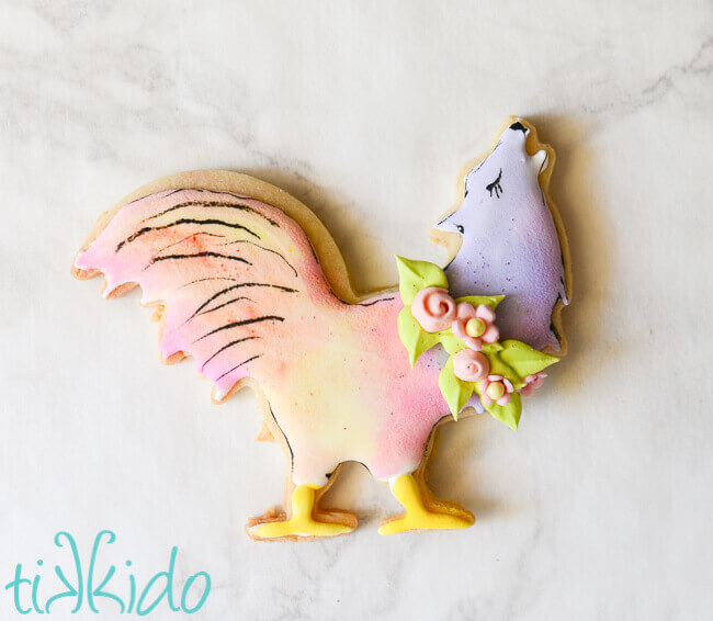 Wooster GISHWHES 2013 mascot sugar cookie in pastel colors on a white marble background
