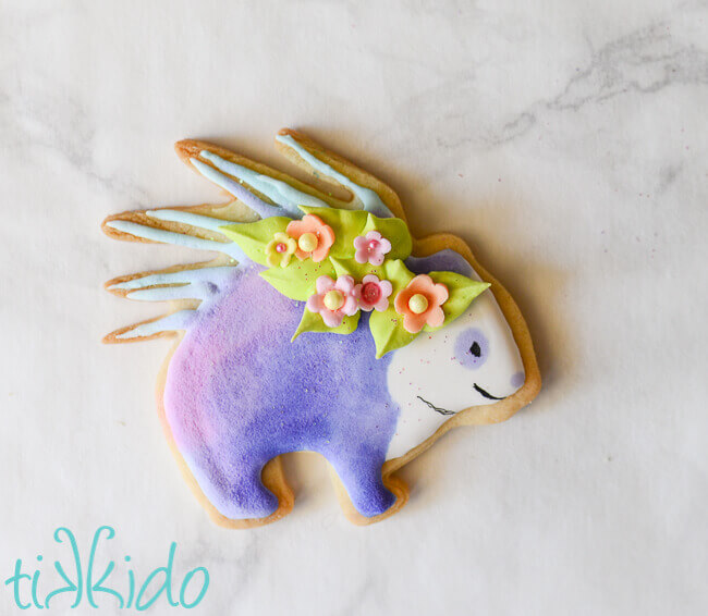 Porcupanda GISHWHES 2017 mascot sugar cookie in pastel colors on a white marble background