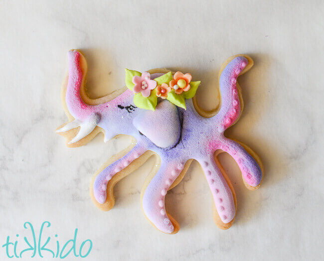 Elopus GISHWHES 2014 mascot sugar cookie in pastel colors on a white marble background