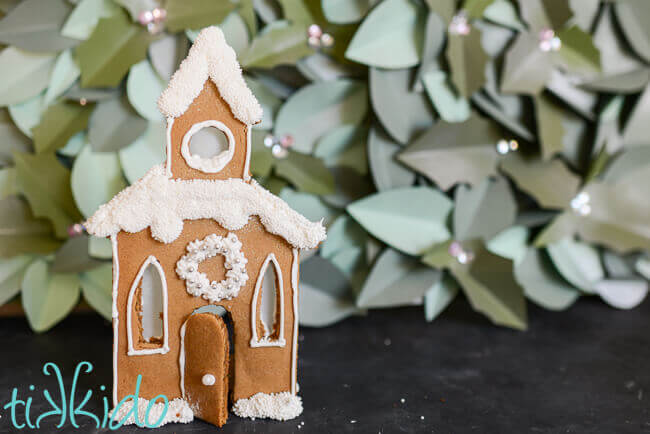 Gingerbread House church Candle Holder decorated with royal icing and sprinkles.