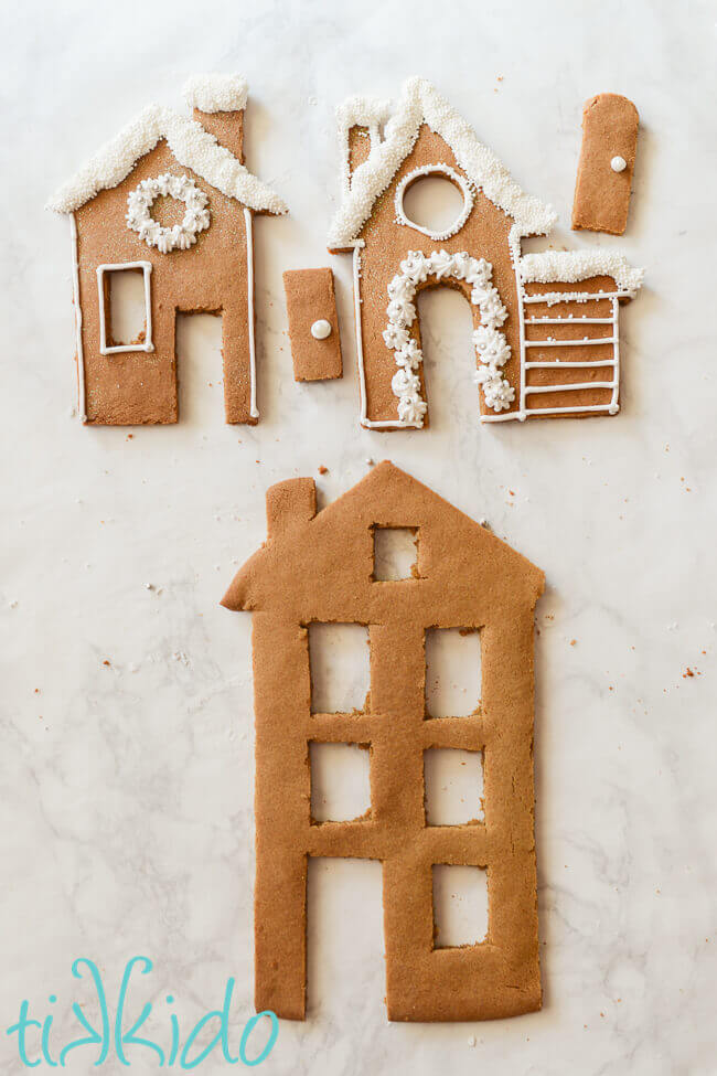 Facades for the Gingerbread House Candle Holders being decorated with royal icing.