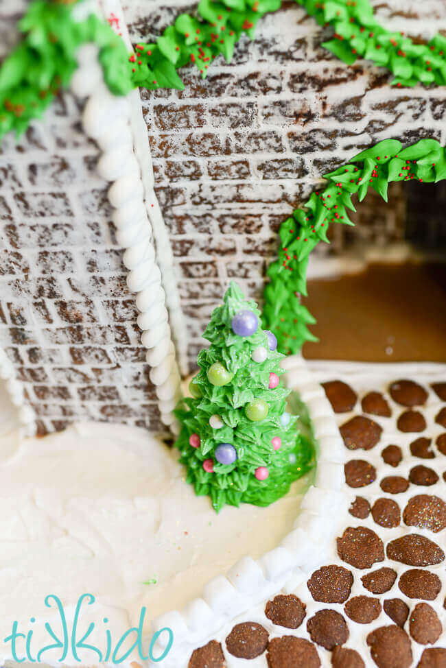 Detail shot of royal icing Christmas tree on the Gingerbread Castle.