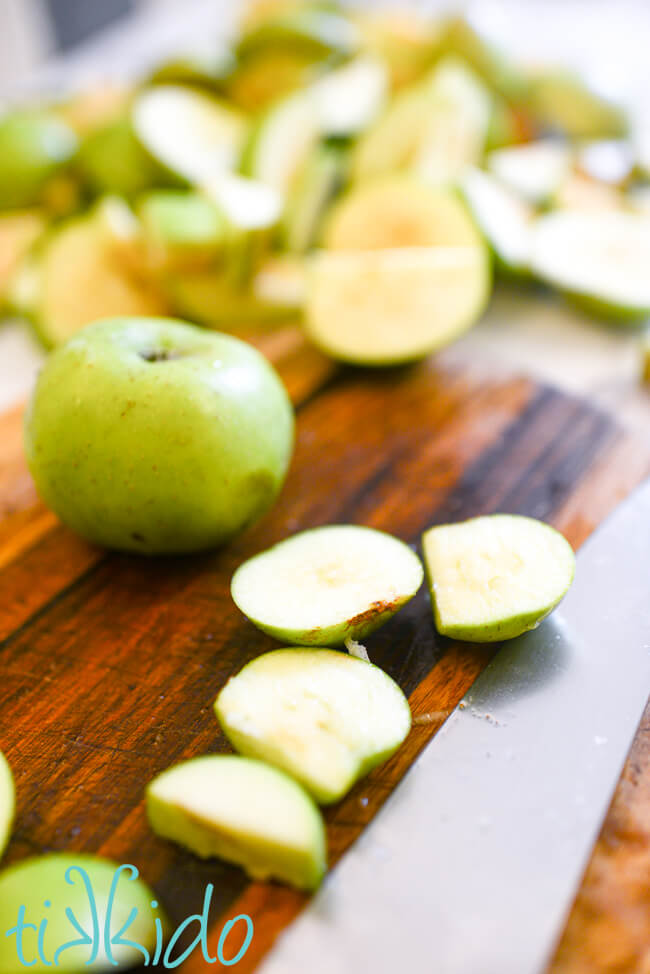 Bramley cooking apples being sliced for Instant Pot Apple Butter Recipe.