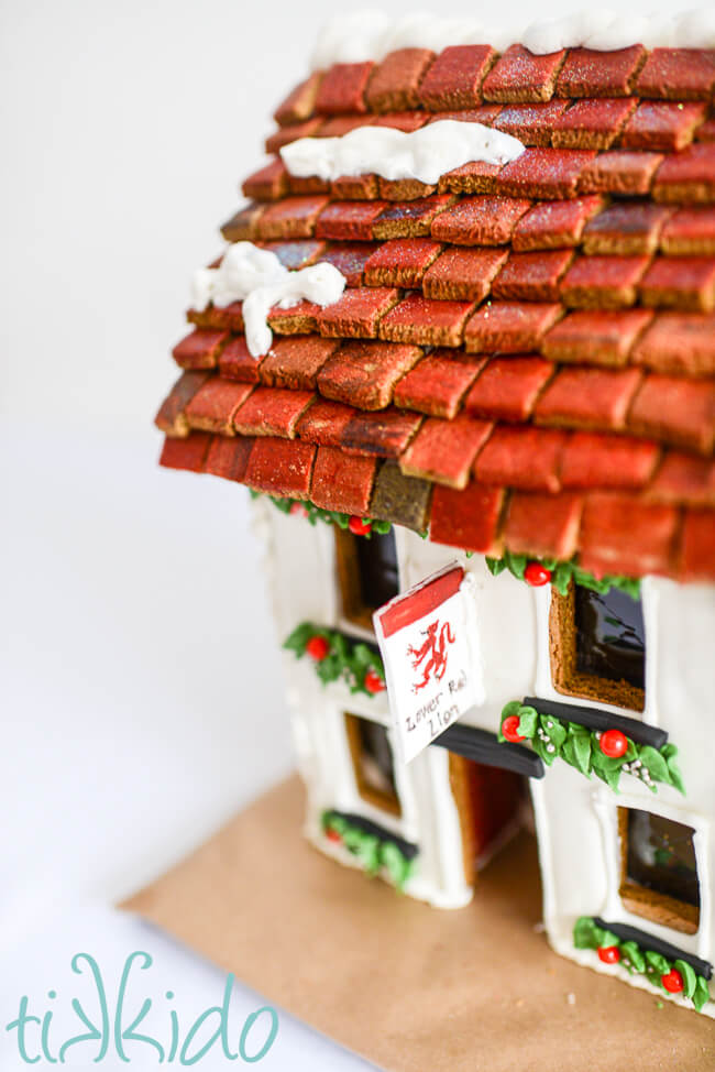 Closeup of the roof and sign on the Lower Red Lion gingerbread pub.