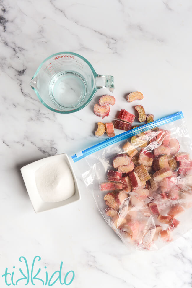 Ingredients for Stewed Rhubarb Recipe on a white marble surface.