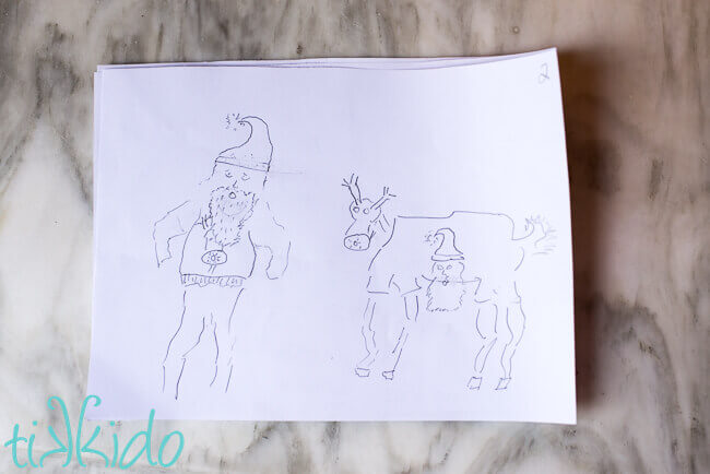 Drawing of santa wearing a Rudolph sweater, and Rudolph wearing a Santa sweater for a game of Telephone Pictionary