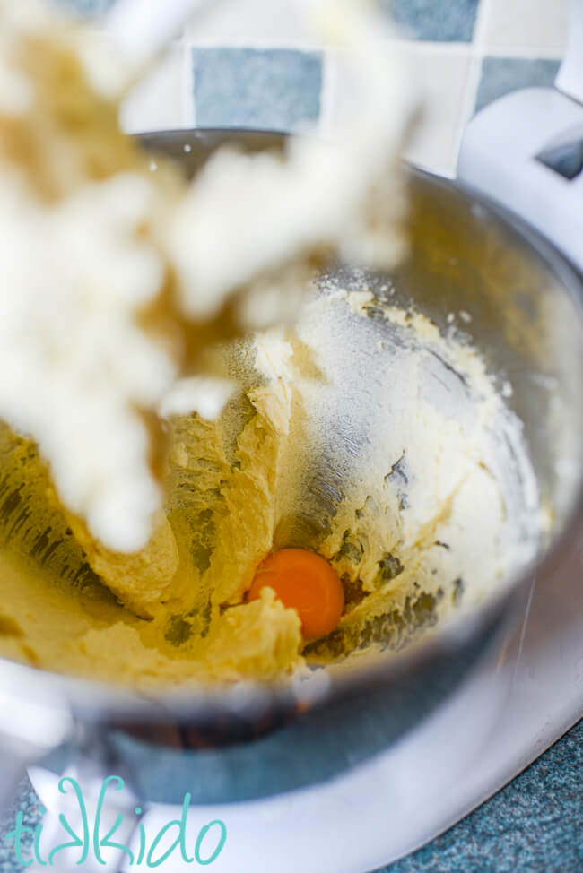Eggs being added to the vanilla butter cake batter.