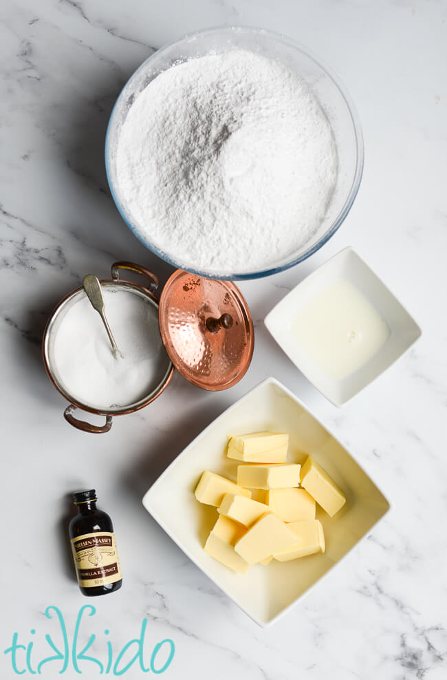 Ingredients for American Buttercream Frosting Recipe on a marble surface.