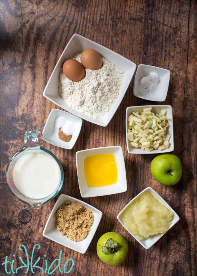 Ingredients for apple pancakes recipe on a wooden table.