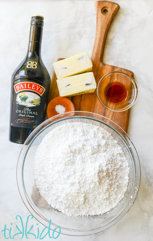 Ingredients for Bailey's Frosting on a wooden cutting board.