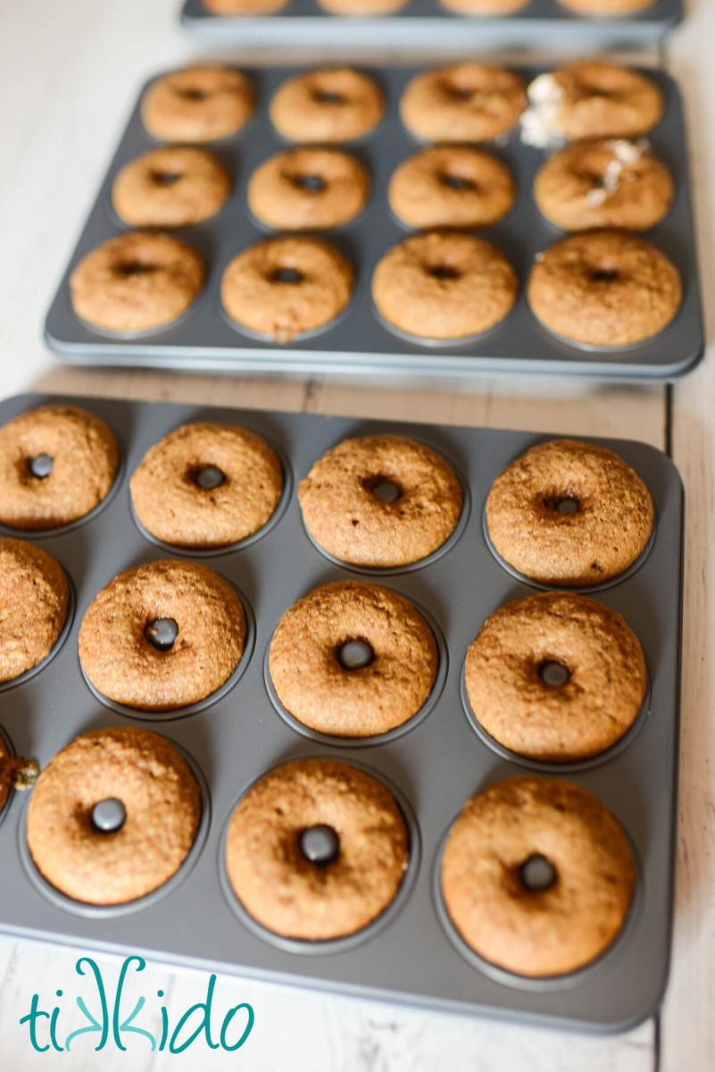 Baked apple cider donuts in donut pans.