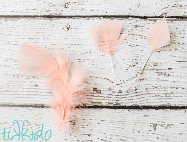 Photo showing feathers being shaped and trimmed for a BOHO gift wrapping tutorial.