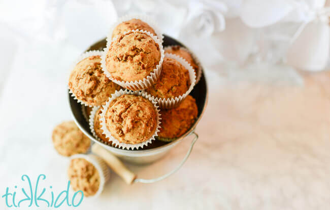 Silver galvanized metal pail full of homemade bran muffins.