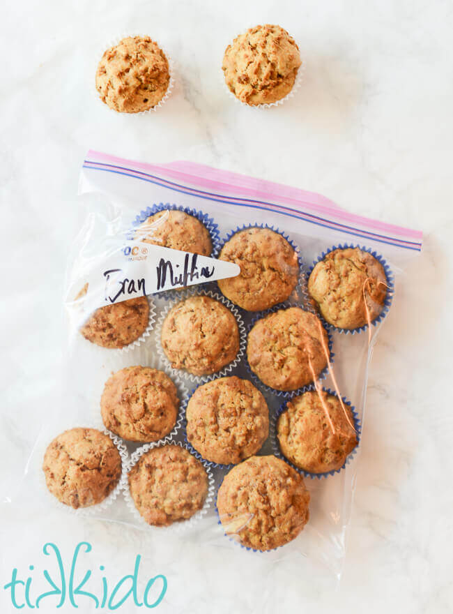 Gallon sized freezer bag full of a dozen bran muffins ready to freeze.