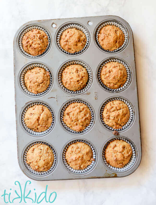 Freshly baked bran muffins in a muffin tin.