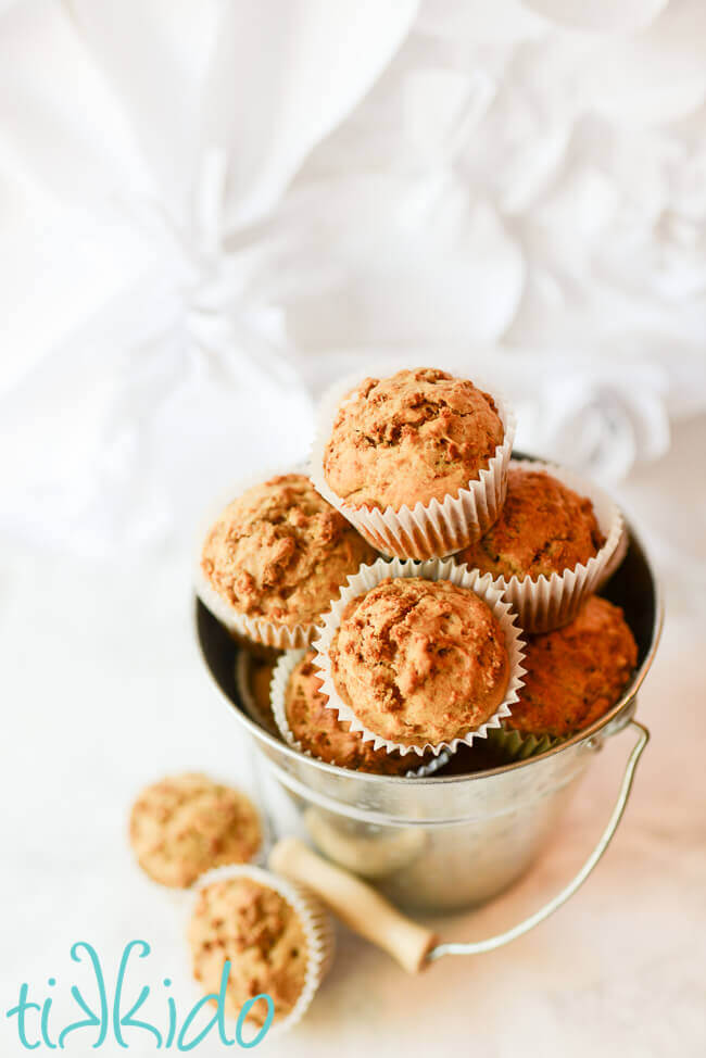 Silver galvanized metal pail full of homemade bran muffins.