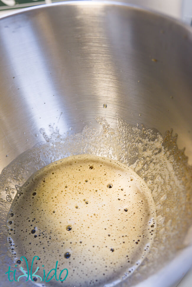 Browned butter in a stainless steel bowl for making streusel topping for muffins.