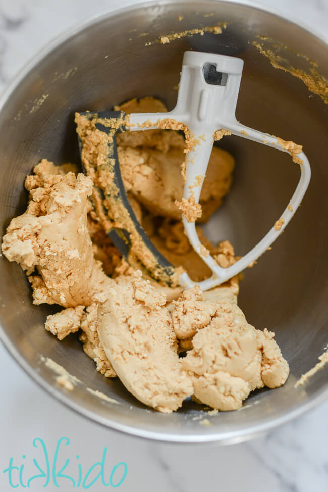 Buckeye Candy peanut butter ball ingredients mixed together in a Kitchenaid mixer.
