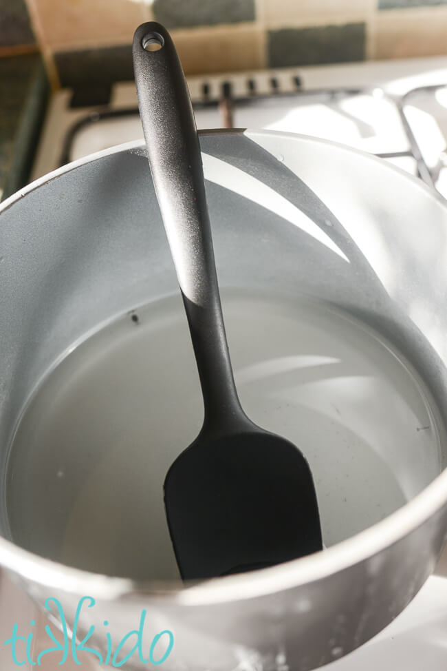 Simple syrup being made in a pot to make Cake Soak Recipe.