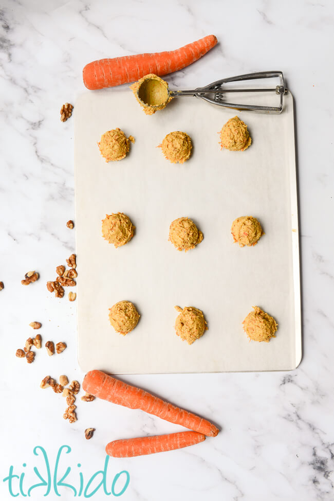 Carrot Cake Cookie dough scooped on a cookie sheet and ready to bake.