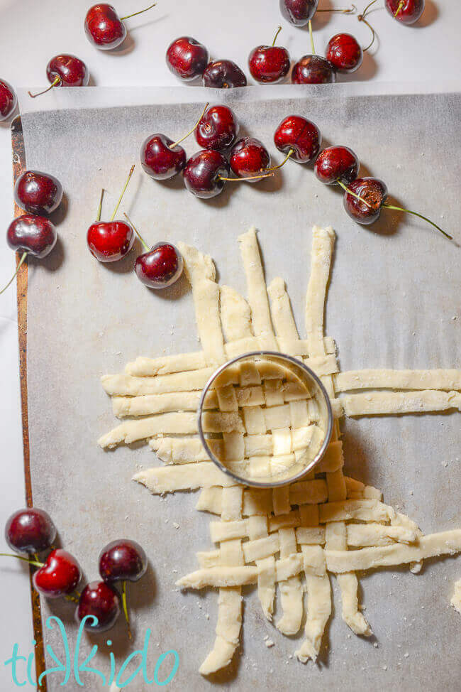 Pie crust being cut into a lattice woven circle to garnish the cherry pie milkshake