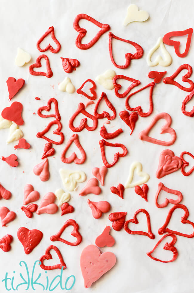 Red, white, and pink chocolate hearts to decorate Valentine's day cupcakes.