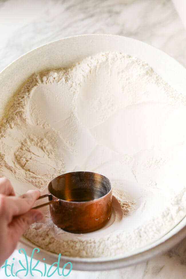 Flour being shaped into a well for the Cinnamon rolls recipe