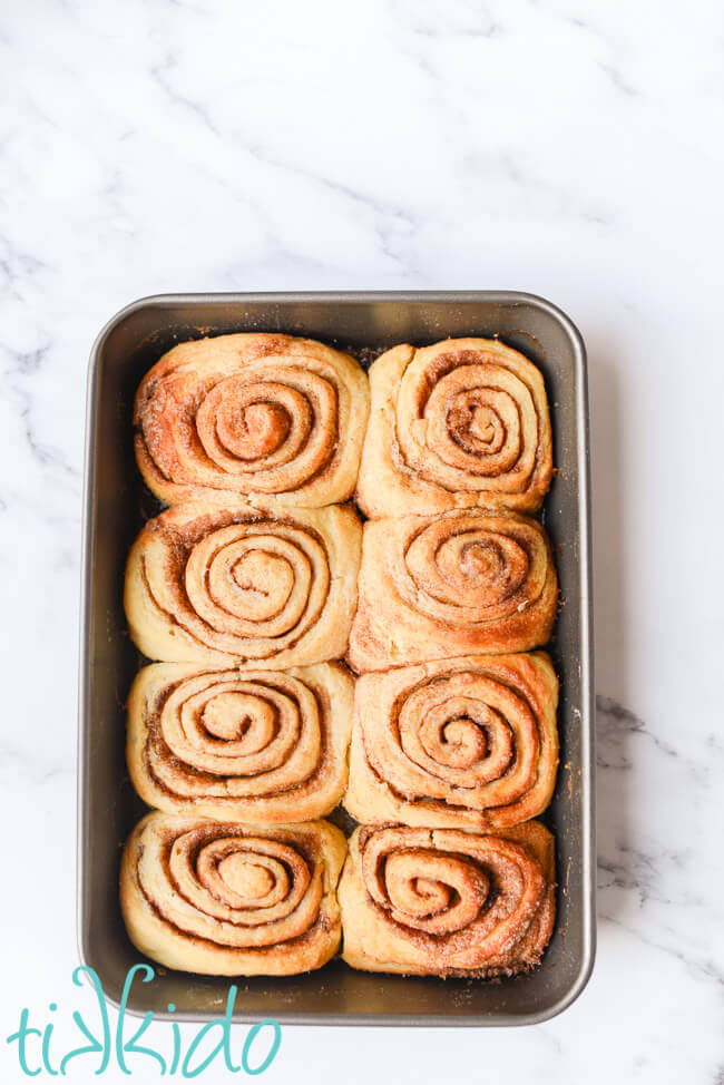 9x13 pan filled with no knead cinnamon rolls.