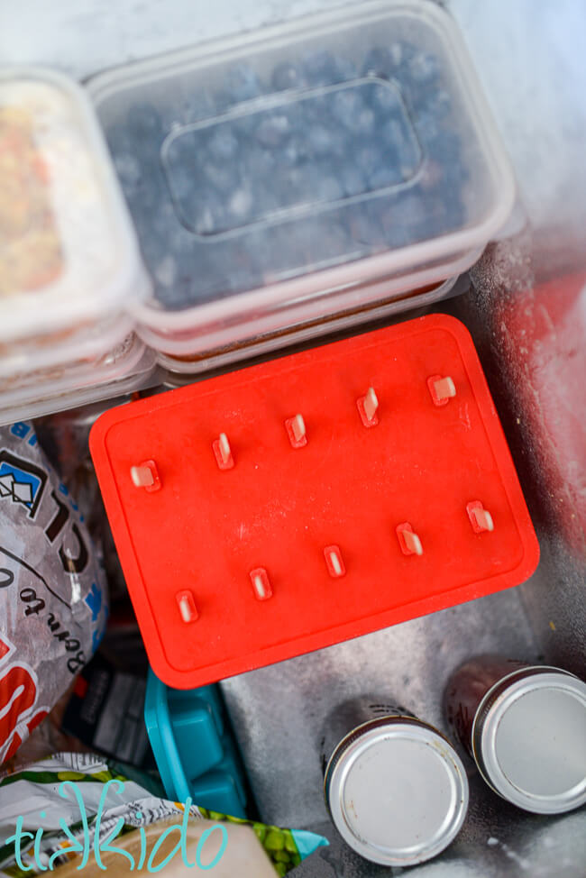 Coffee Popsicles freezing overnight in a chest freezer.