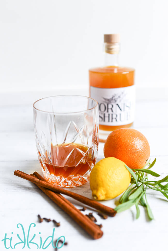 Cornish shrub drink called Rum and Shrub in front of a bottle of Cornish shrub cordial.