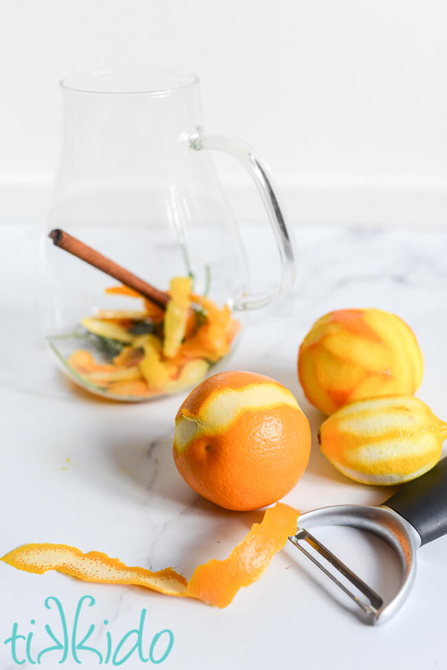 Citrus zest being peeled off of an orange to make the Cornish Shrub Recipe.
