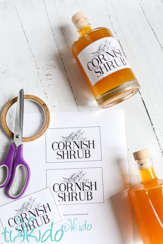 Cornish shrub bottle labels ready to be put on bottles of homemade Cornish shrub cordial.