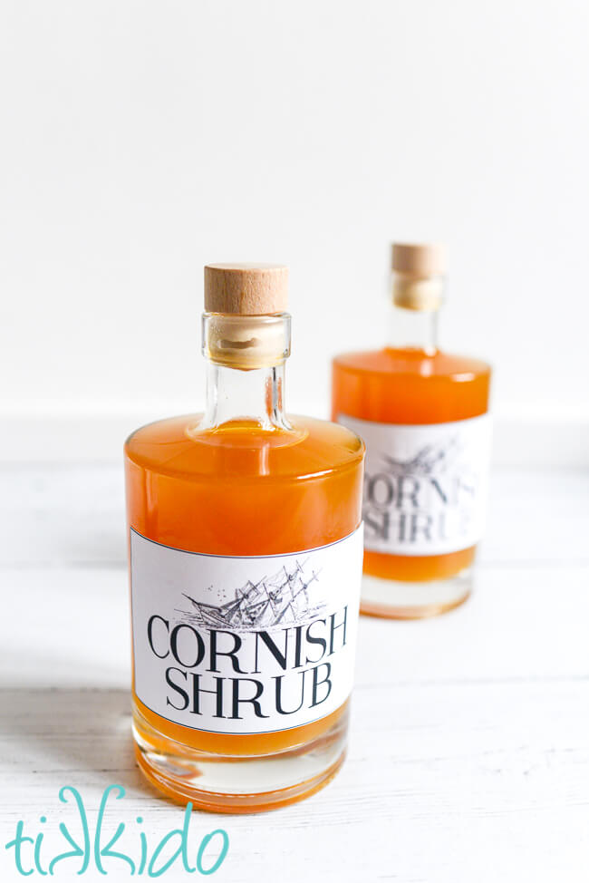 Two bottles of homemade Cornish shrub on a white background.