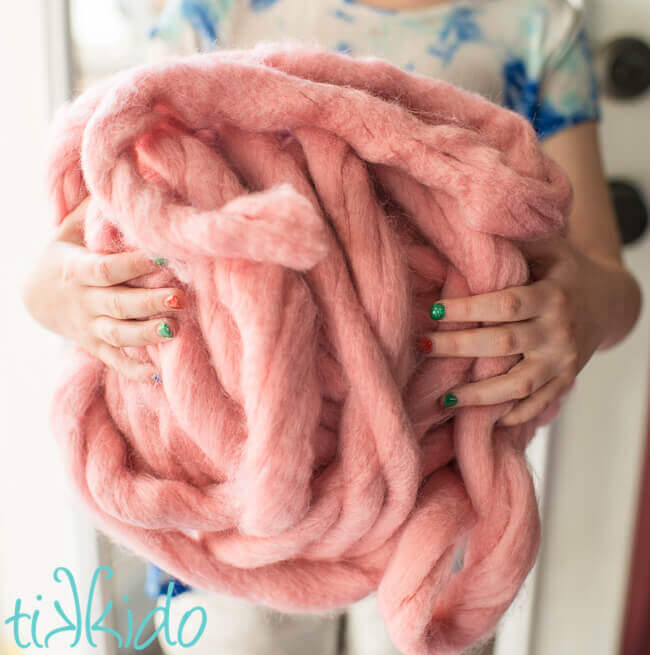 Extra chunky pink roving yarn.