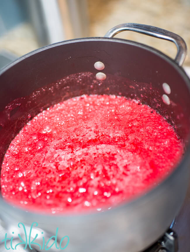 Sugar and butter mixture in a saucepan for making a cotton candy popcorn recipe.