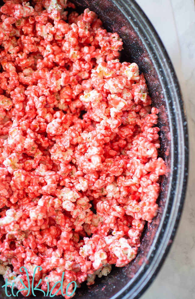 Cotton candy popcorn in a roasting pan, ready to be cooked in the oven.