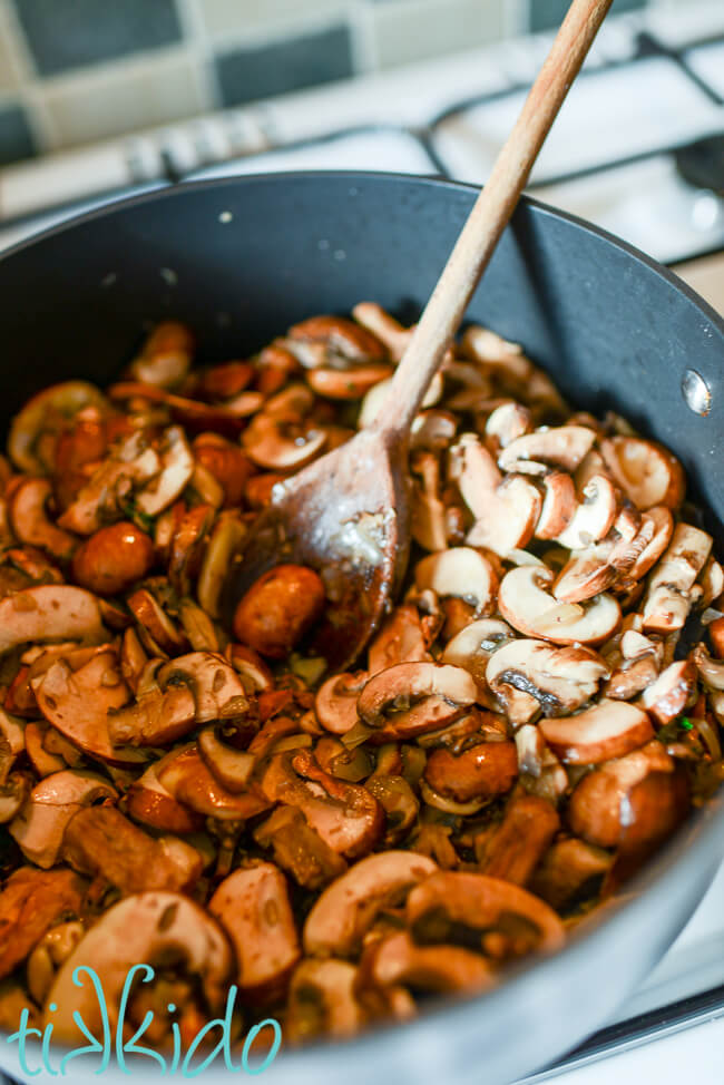 Mushrooms being cooked in a large pot for a Cream of Mushroom Soup Recipe.