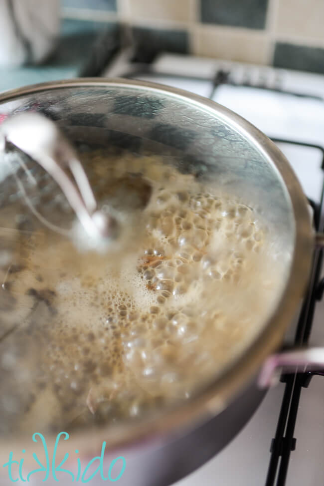 Cream of Mushroom Soup simmering in a lidded pot.