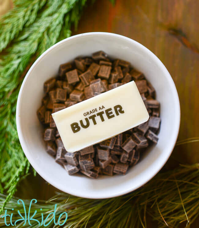 Ingredients for the third layer of no bake mint chocolate bars in a white bowl.