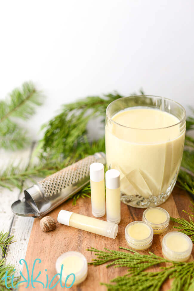 Eggnog Lip Balm (DIY lip balm for Christmas) on a wooden cutting board.