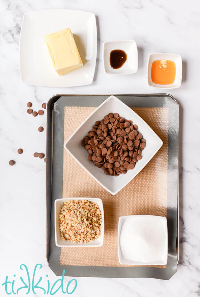 English toffee ingredients on a white marble background.