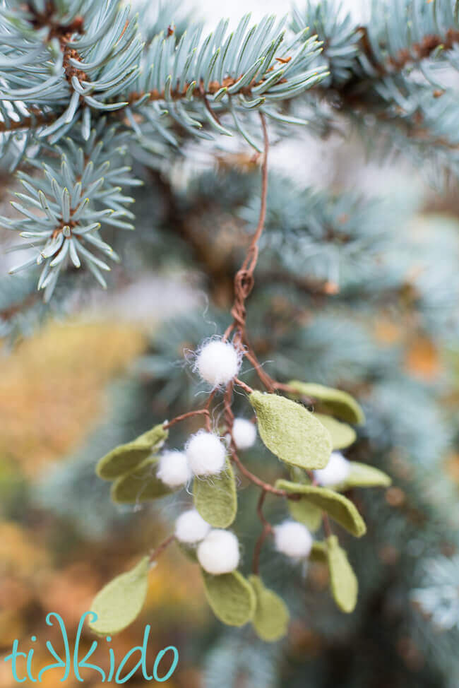 Mistletoe Ornament hanging in a Christmas tree.