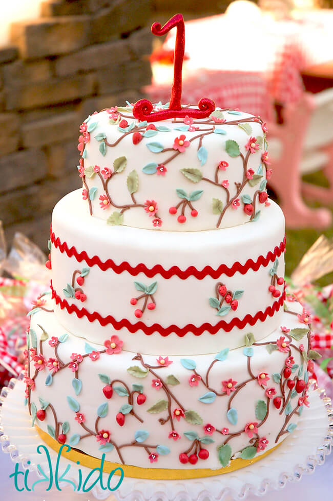 Fondant covered cake inspired by strawberry and cherry print calico fabric.