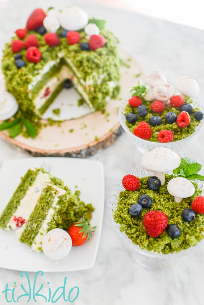 Forest Moss Cake and moss cake individual trifles sitting on a white marble surface.