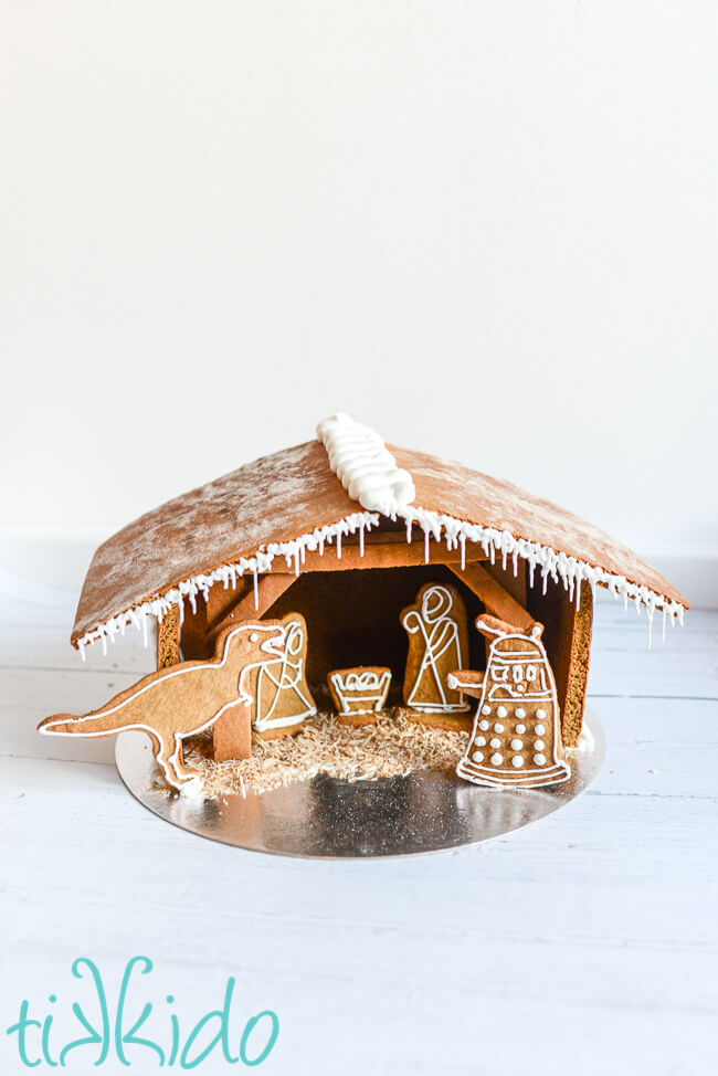 Mr. Bean gingerbread nativity scene with a gingerbread tyrannosaurus rex and gingerbread dalek.