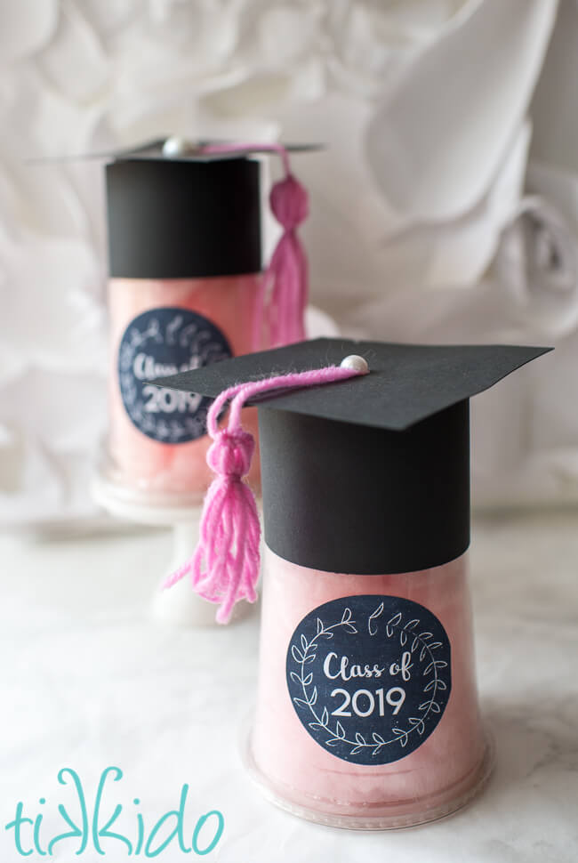 Fillable Graduation Favors that look like graduation caps, filled with cotton candy.