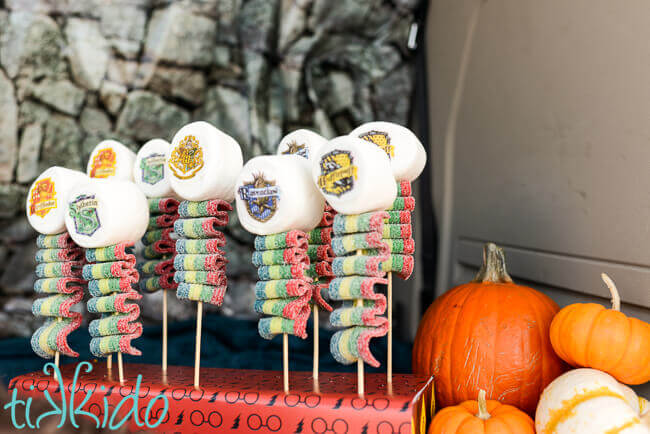 Harry Potter Candy Kebabs topped with marshmallows decorated with the Hogwarts house crests.